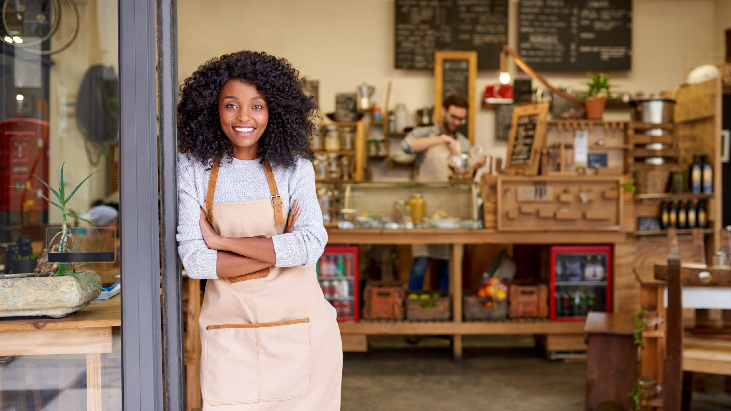 An entrepreneur standing outside of her small business